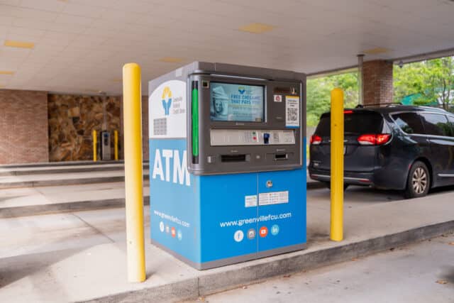 Greenville Federal Credit Union ATM offering free checking located in a covered drive-thru area.