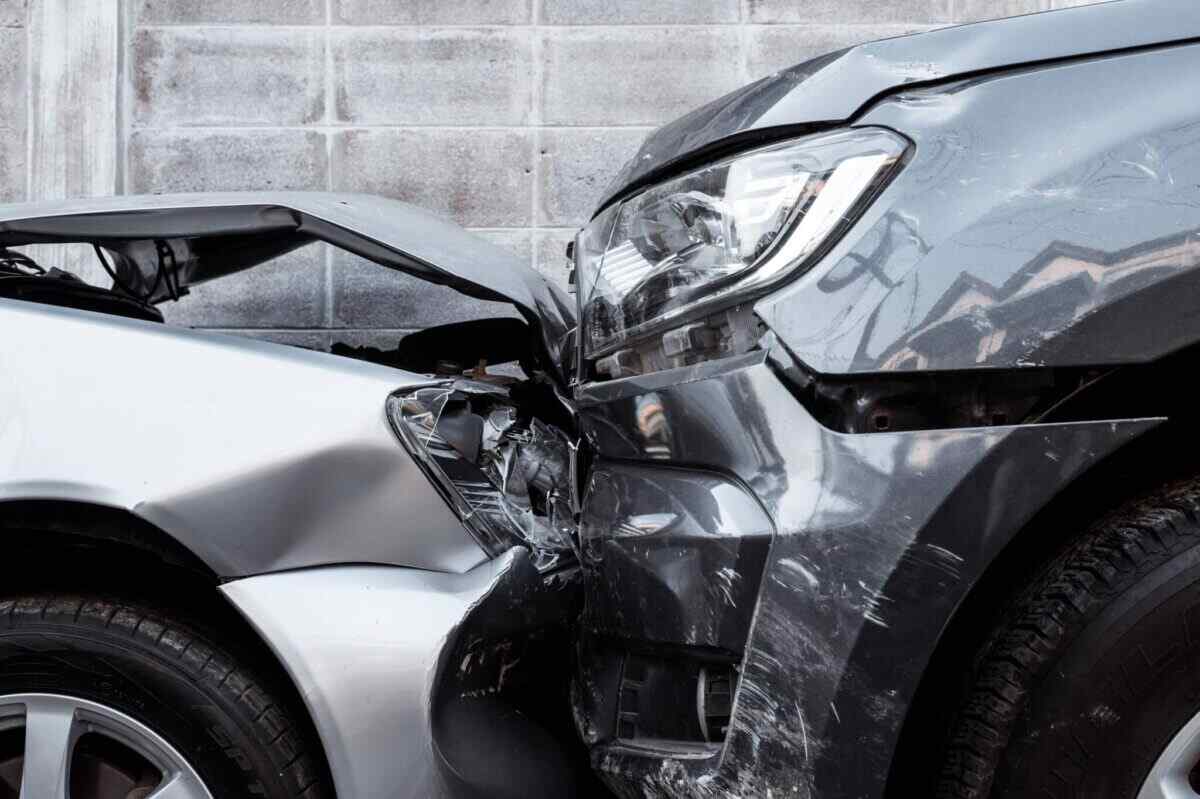 Silver and gray cars involved in a street collision, illustrating the importance of insurance and coverage options to protect your finances.
