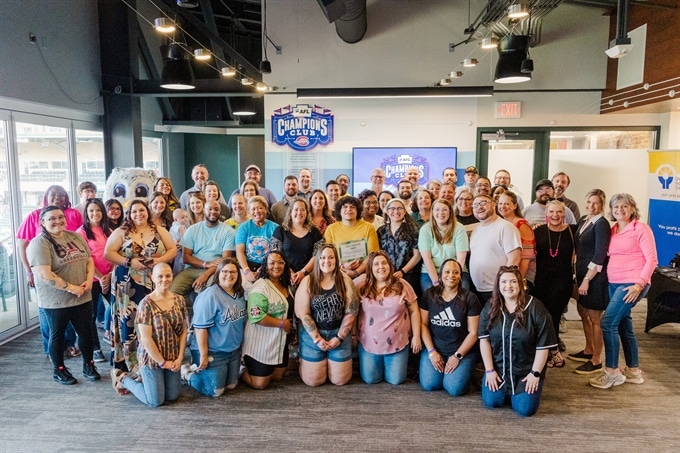 A group of employees casually posing together.