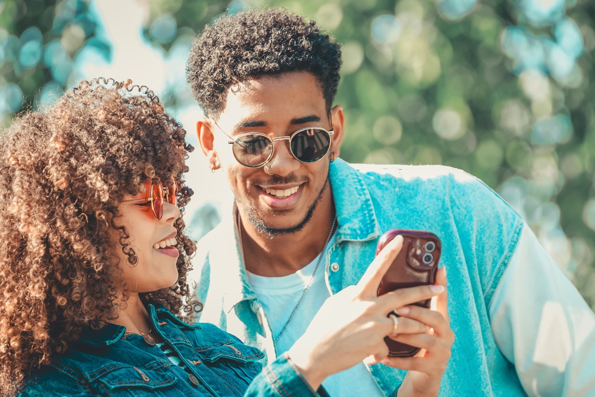 8 Financial Tips for Gen Z That Actually Work young couple looking at phone